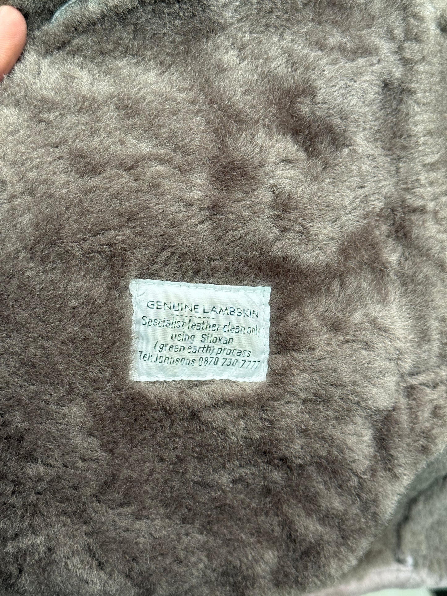 Genuine Lambskin tag on vintage 2000s shearling coat