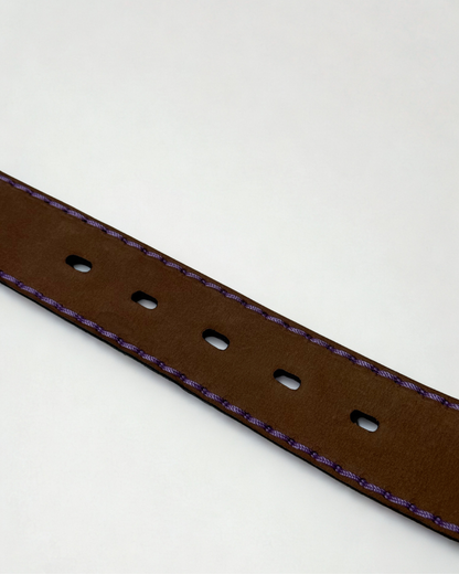 Close up of inside leather texture of vintage JMADE belt in purple and gold