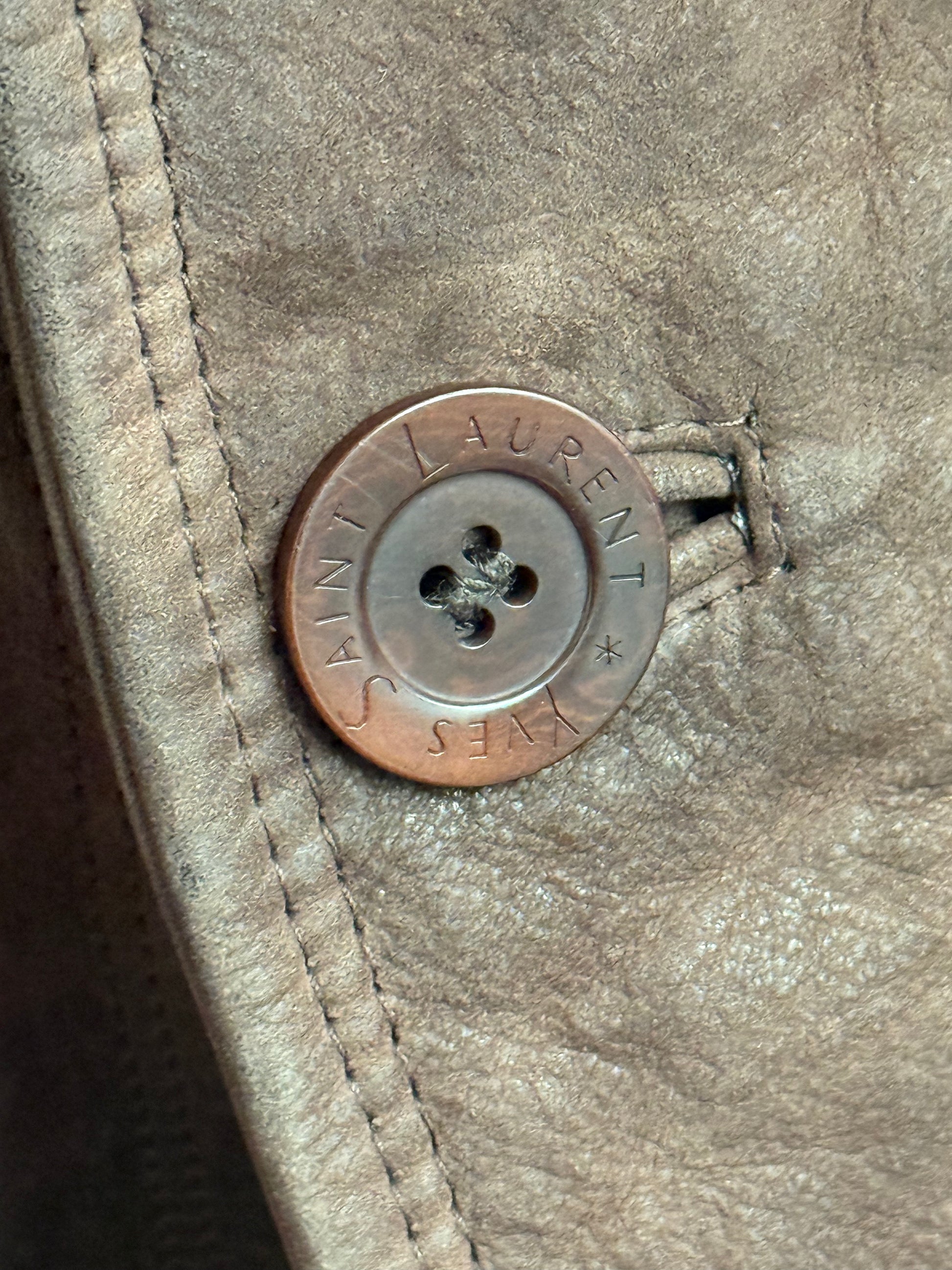 Button detail on Yves Saint Laurent leather jacket