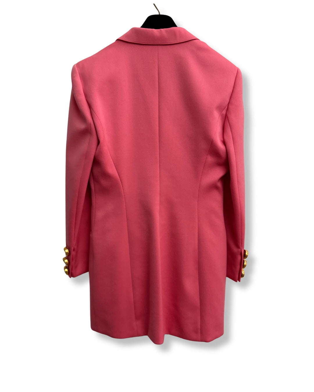 Back view of vintage womens pink blazer showing tailored fit