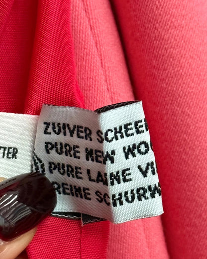 Close up of woolmark on vintage pink suit set