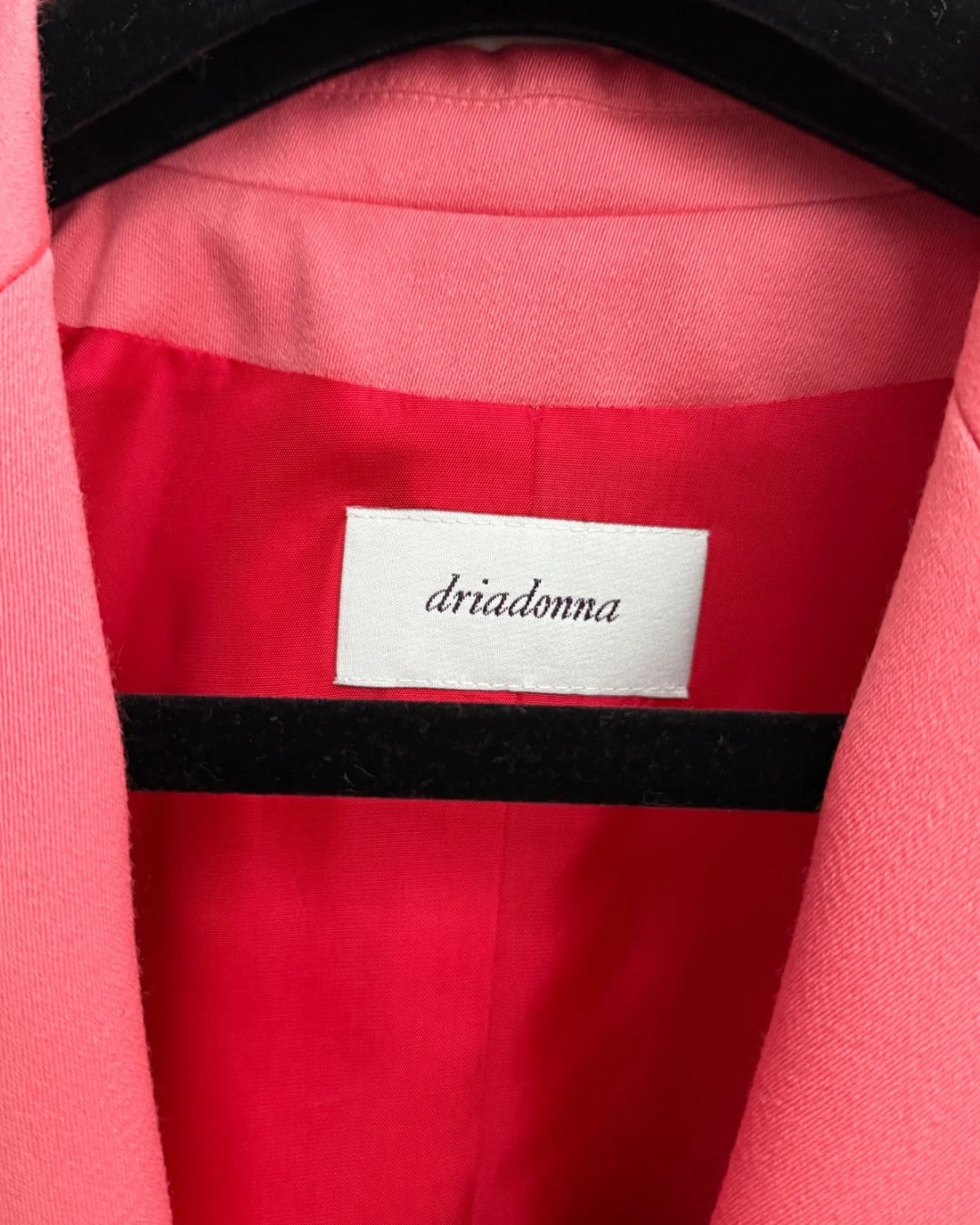 Vintage label detail inside pink womens suit blazer
