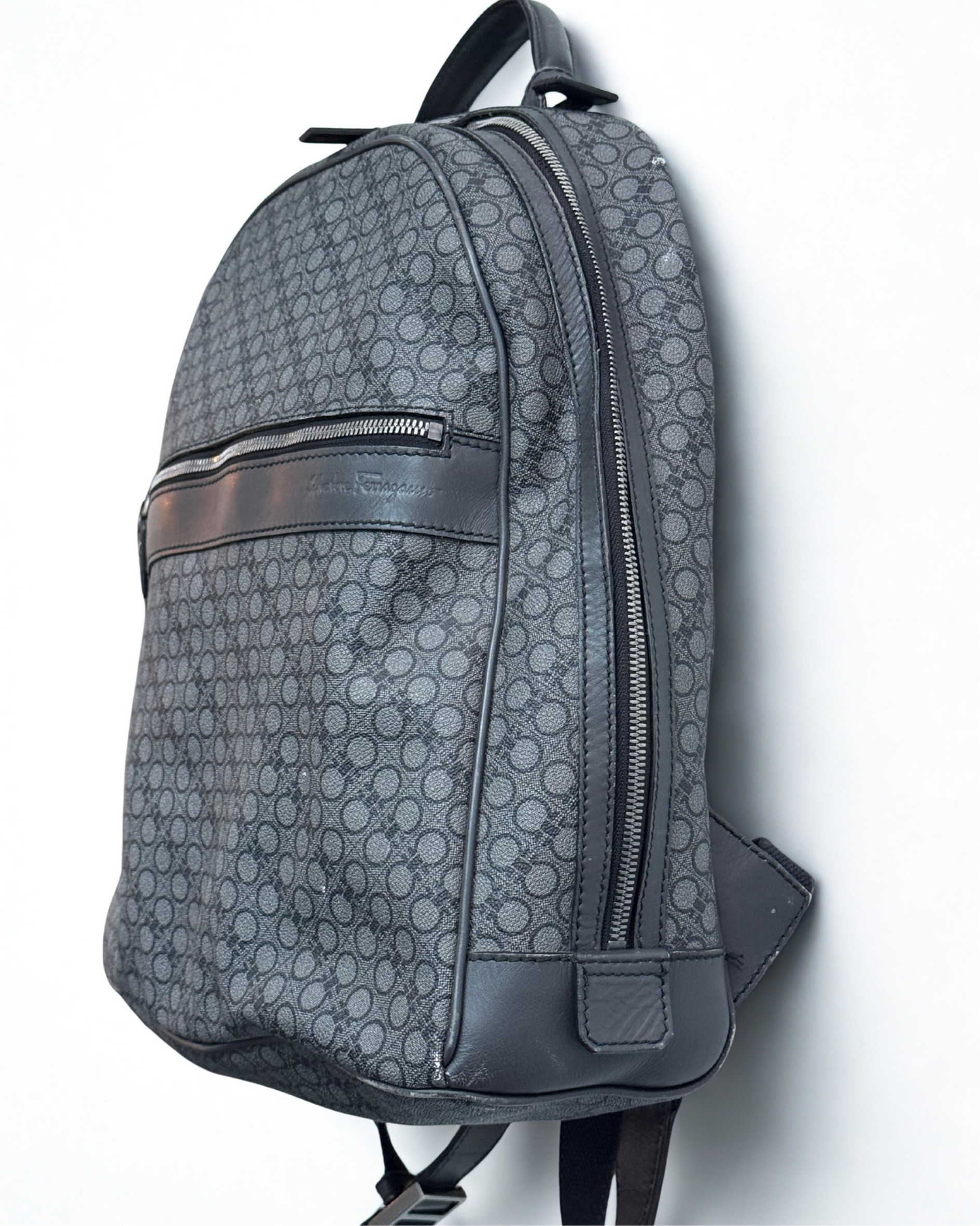 Right Side view of Salvatore Ferragamo grey leather backpack 