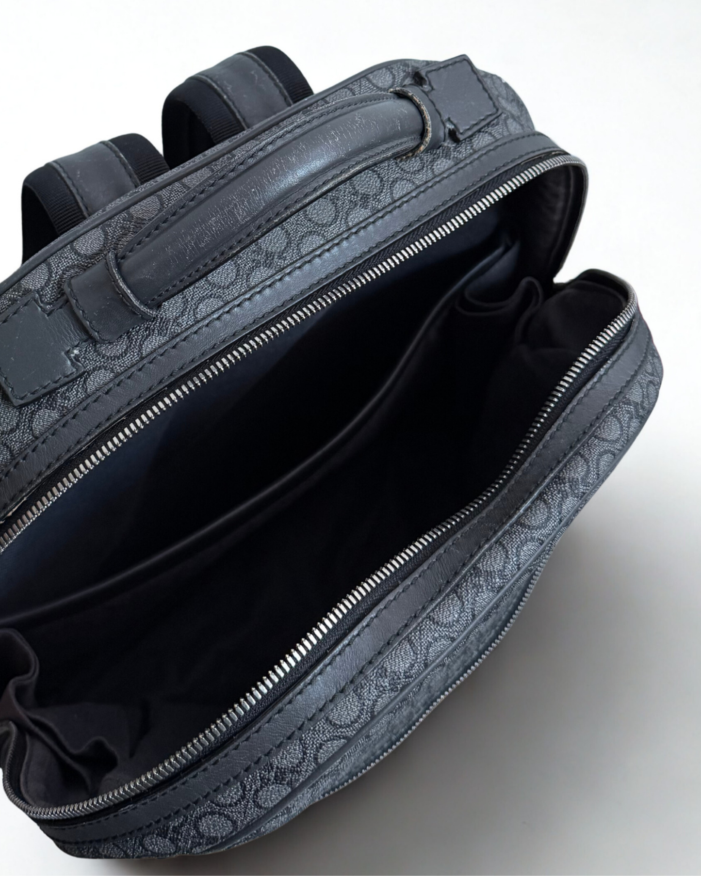 Top view of Salvatore Ferragamo grey leather backpack