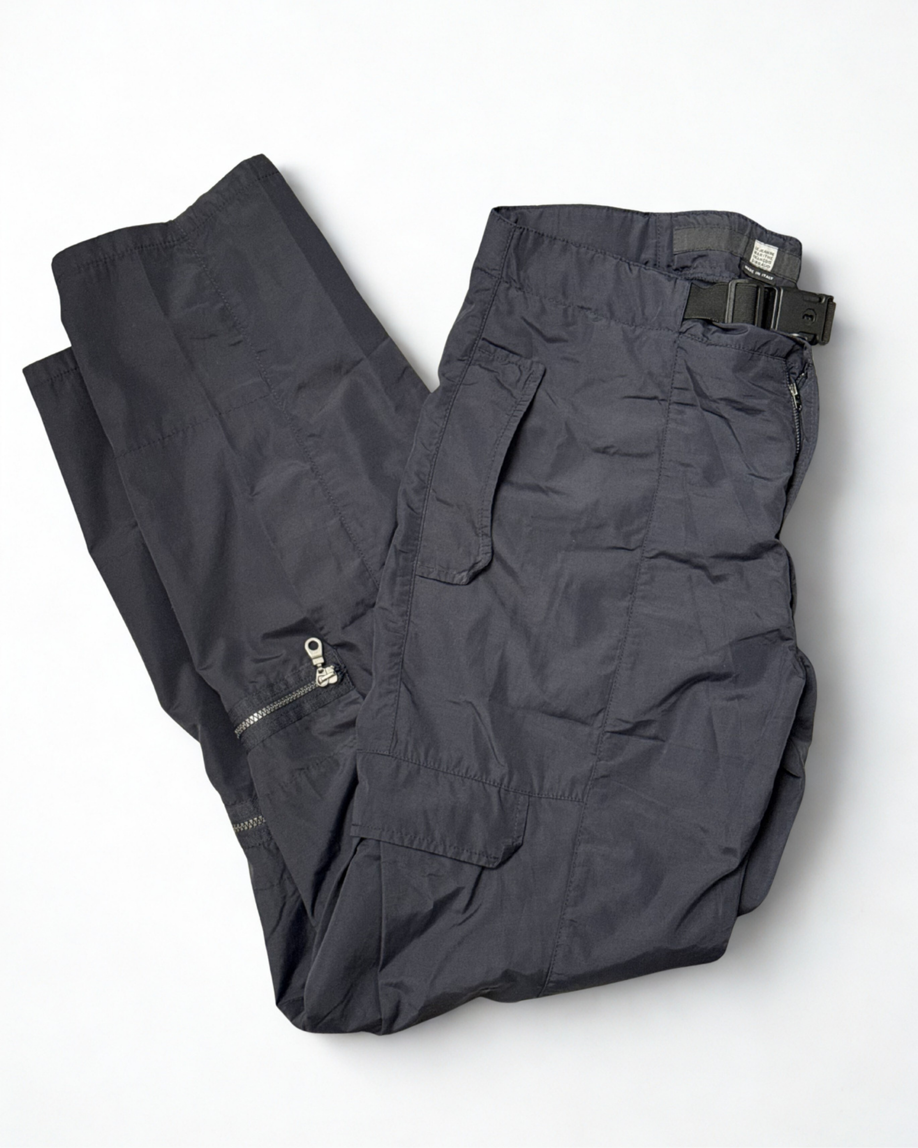 Folded front view of navy Girbaud cargo trousers with zip
