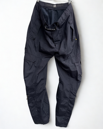 Front view of navy Girbaud cargo trousers hanging