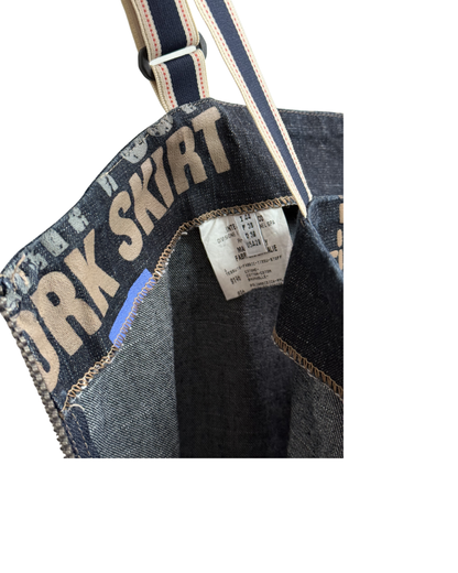 Denim skirt with text and a visible label on a white background