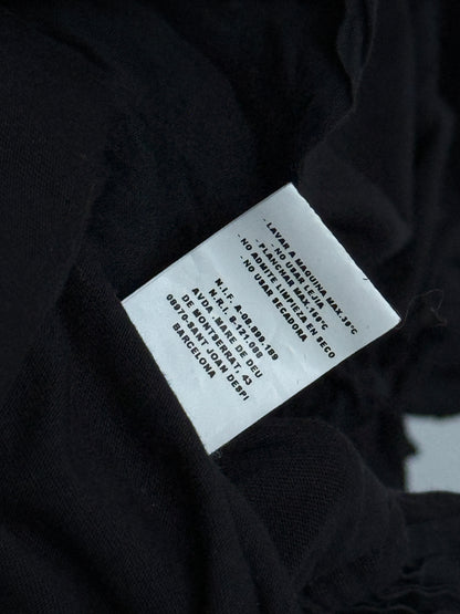 Clothing label on a black fabric background