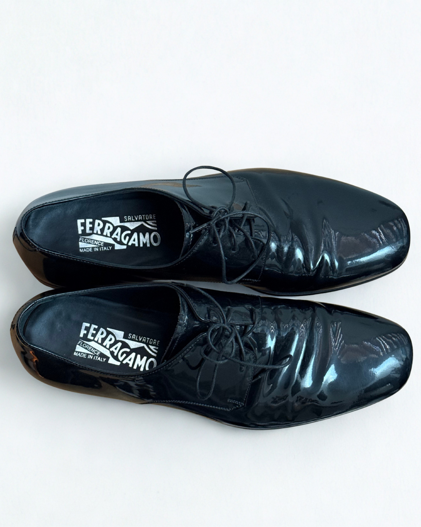 Interior view of Salvatore Ferragamo black patent leather Oxford shoes
