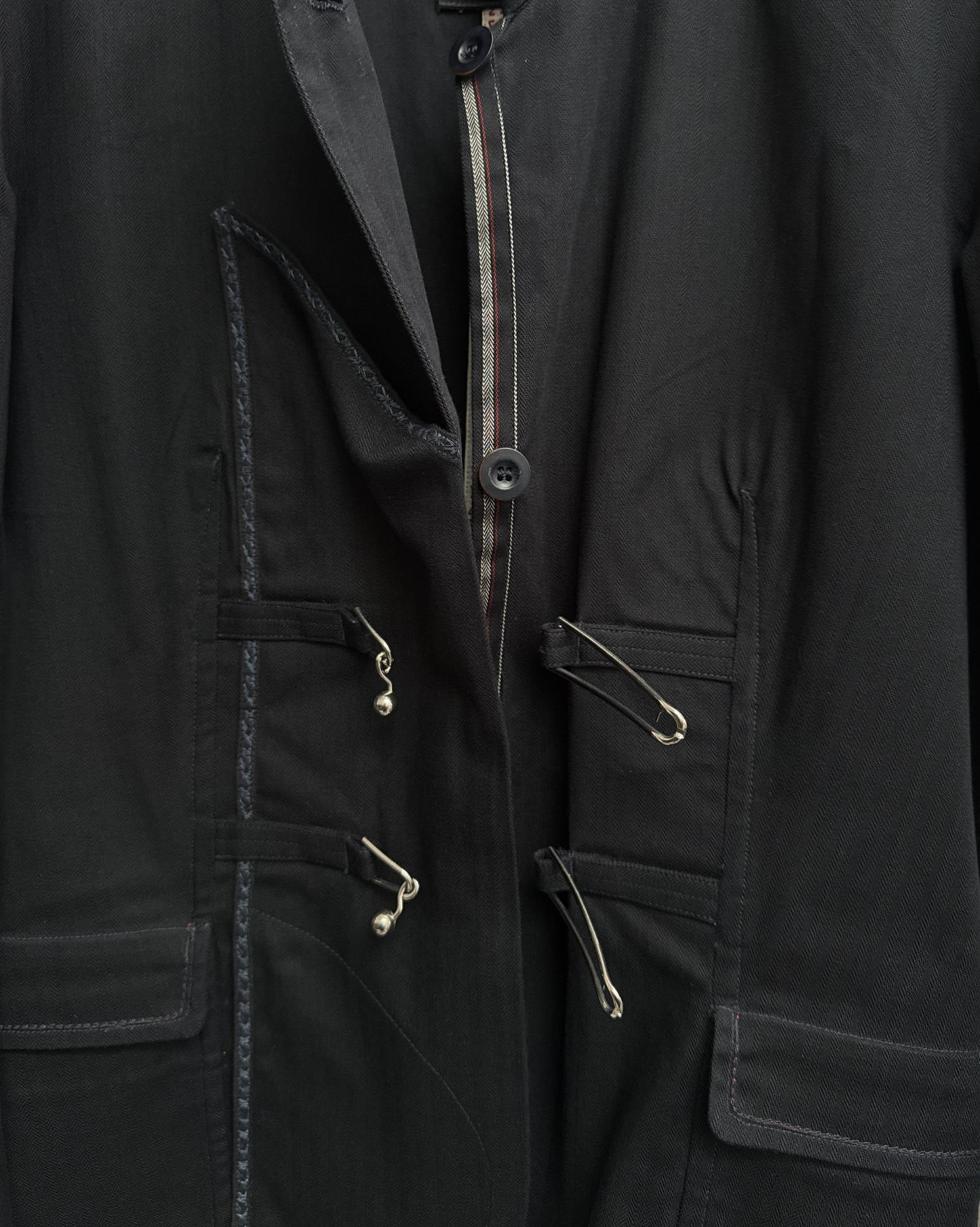 Metal mace style button closure open detail