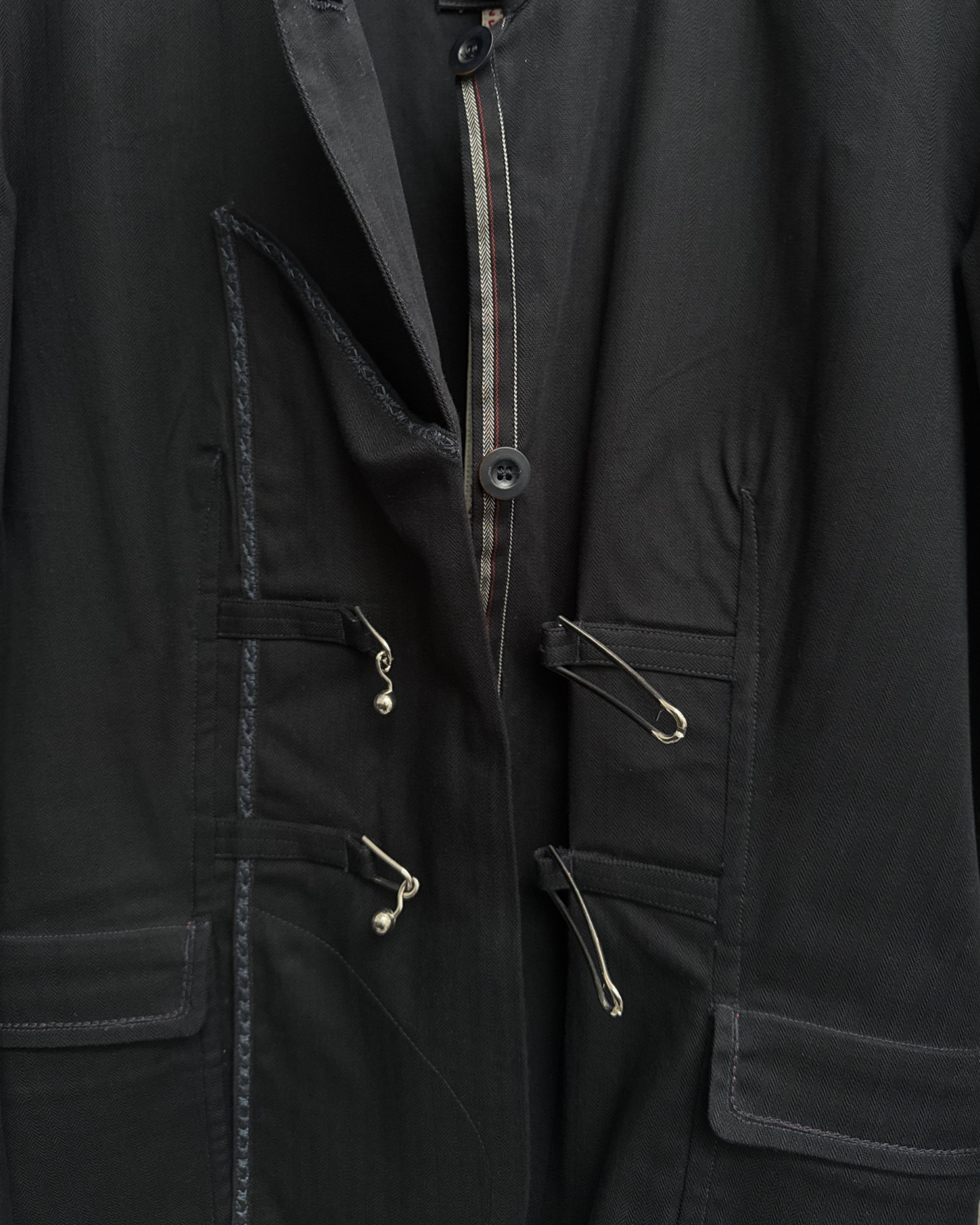 Metal mace style button closure open detail