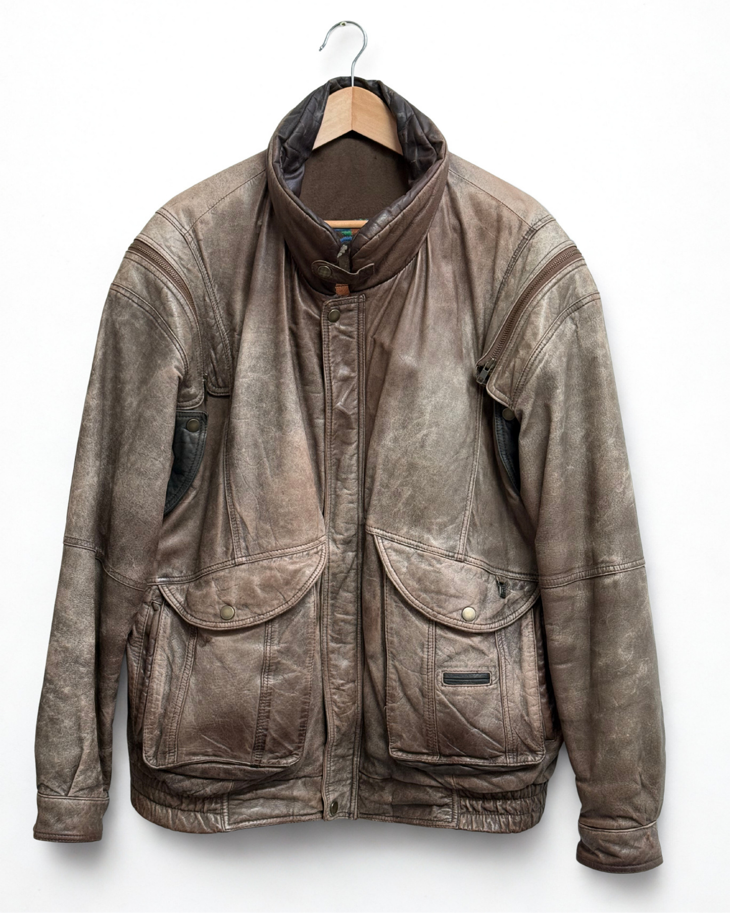 Front view of vintage brown leather bomber jacket with collar up