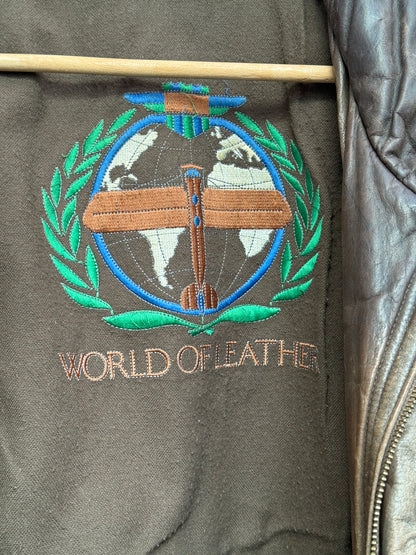 Close up of embroidered logo on vintage leather bomber jacket