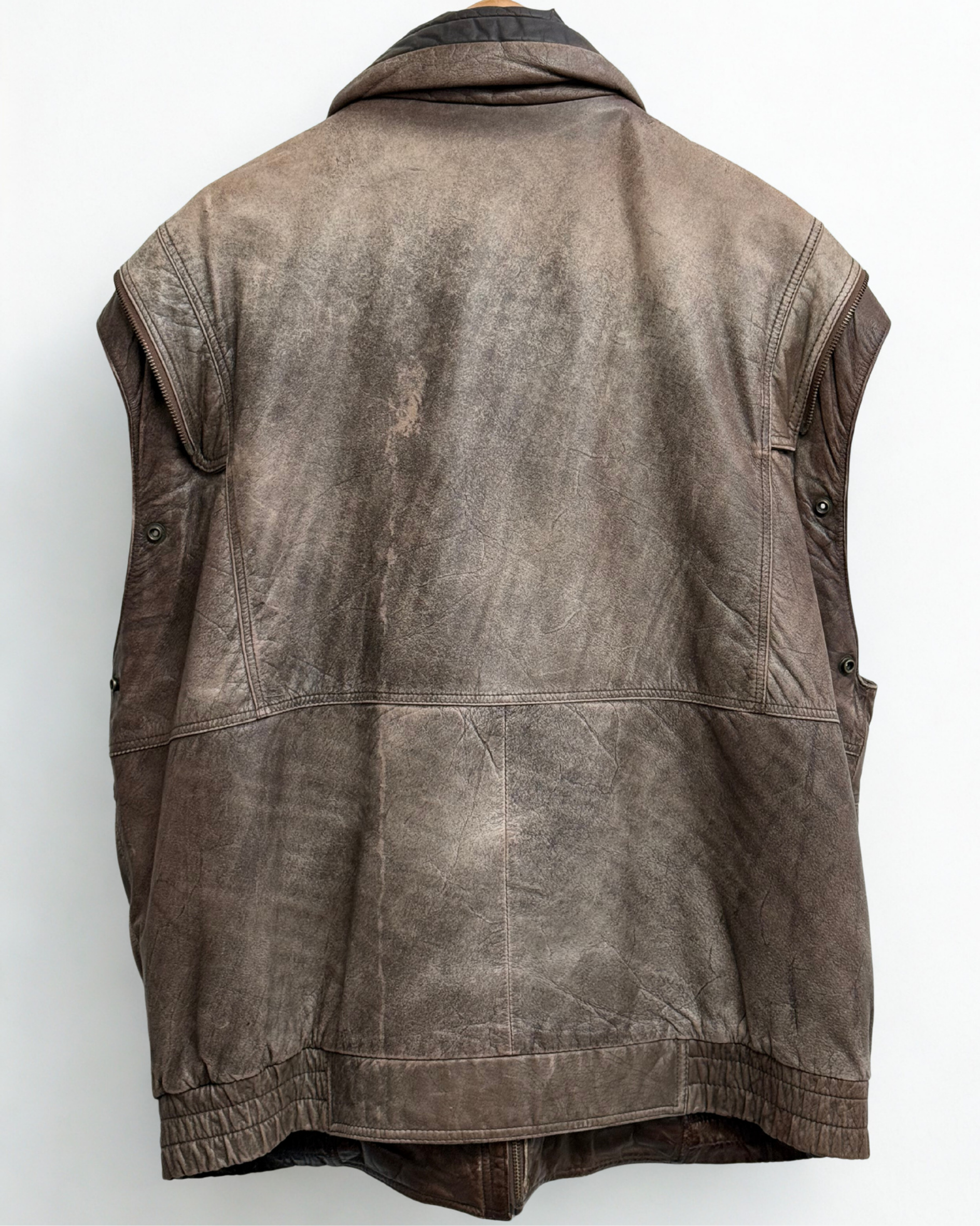 Back view of vintage leather bomber jacket showing structure without sleeve