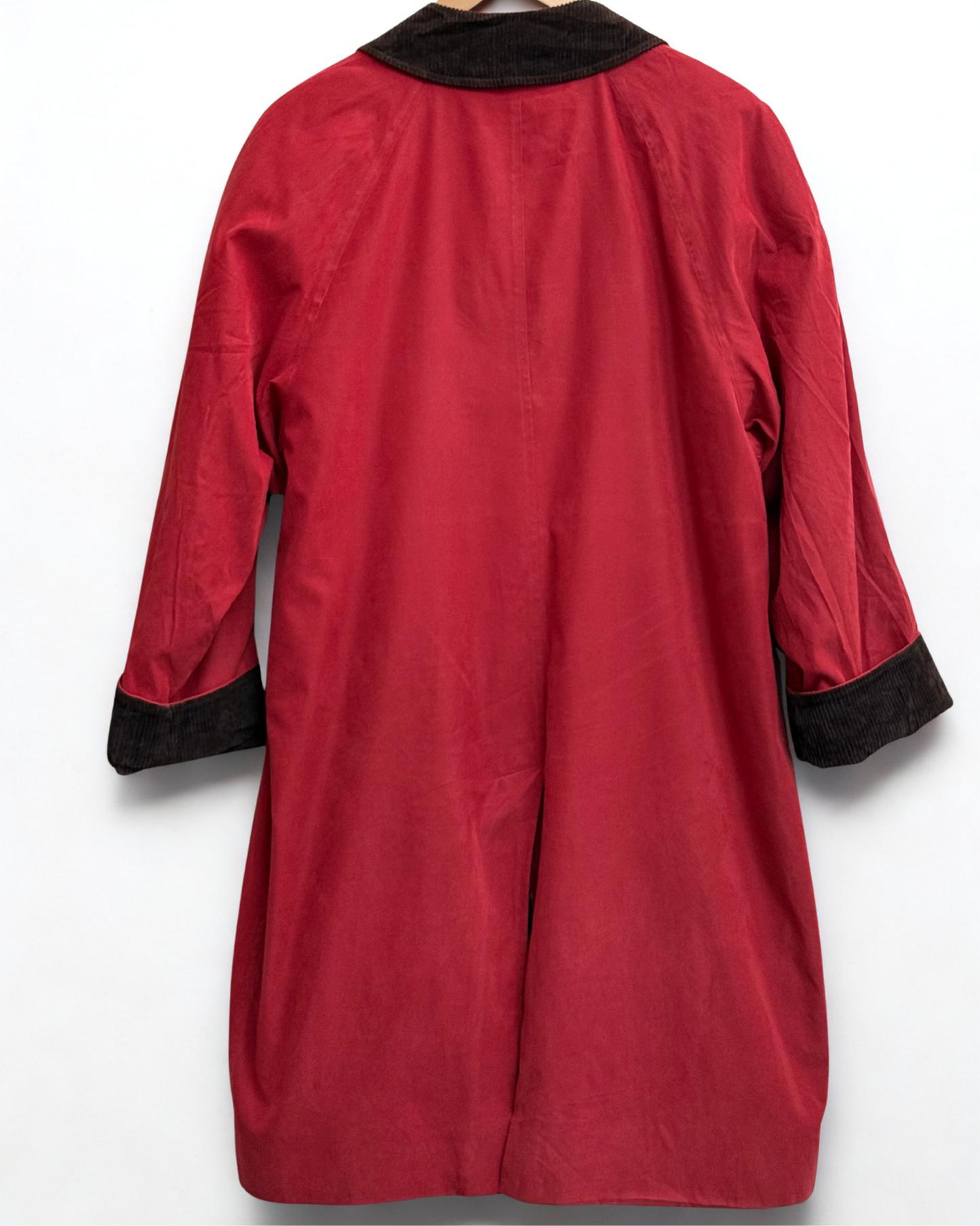 Back view of Burberry’s vintage red overcoat showing silhouette