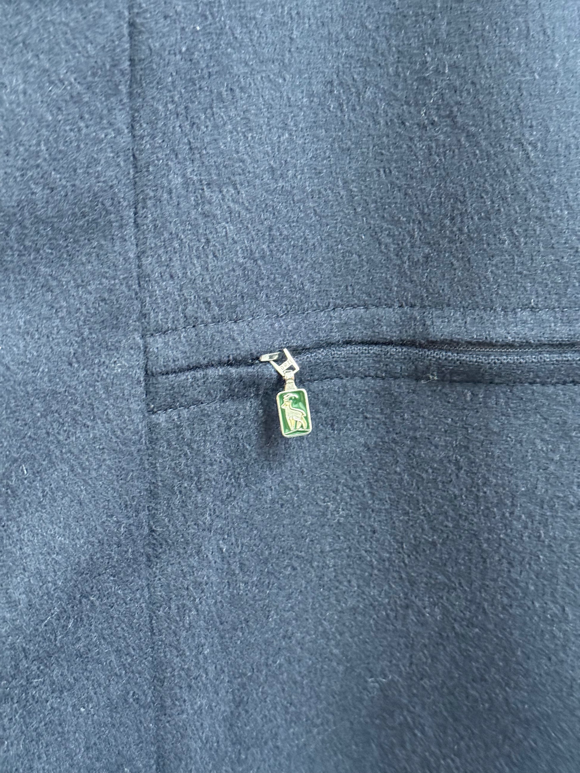 Steinbock zip detail with goat logo outside vintage loden overcoat