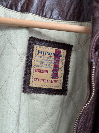 Patino Road brand label detail inside vintage leather overcoat