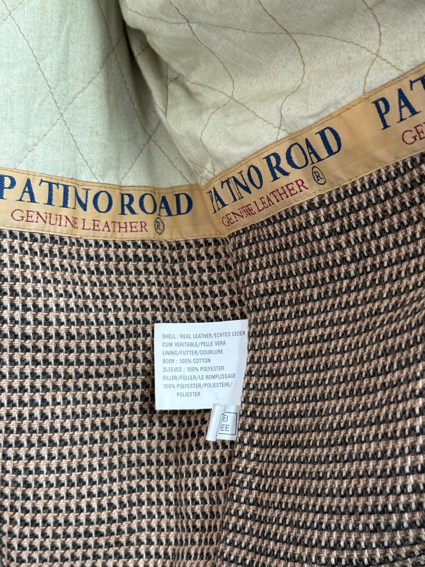 Patino Road brand material label detail inside vintage leather overcoat