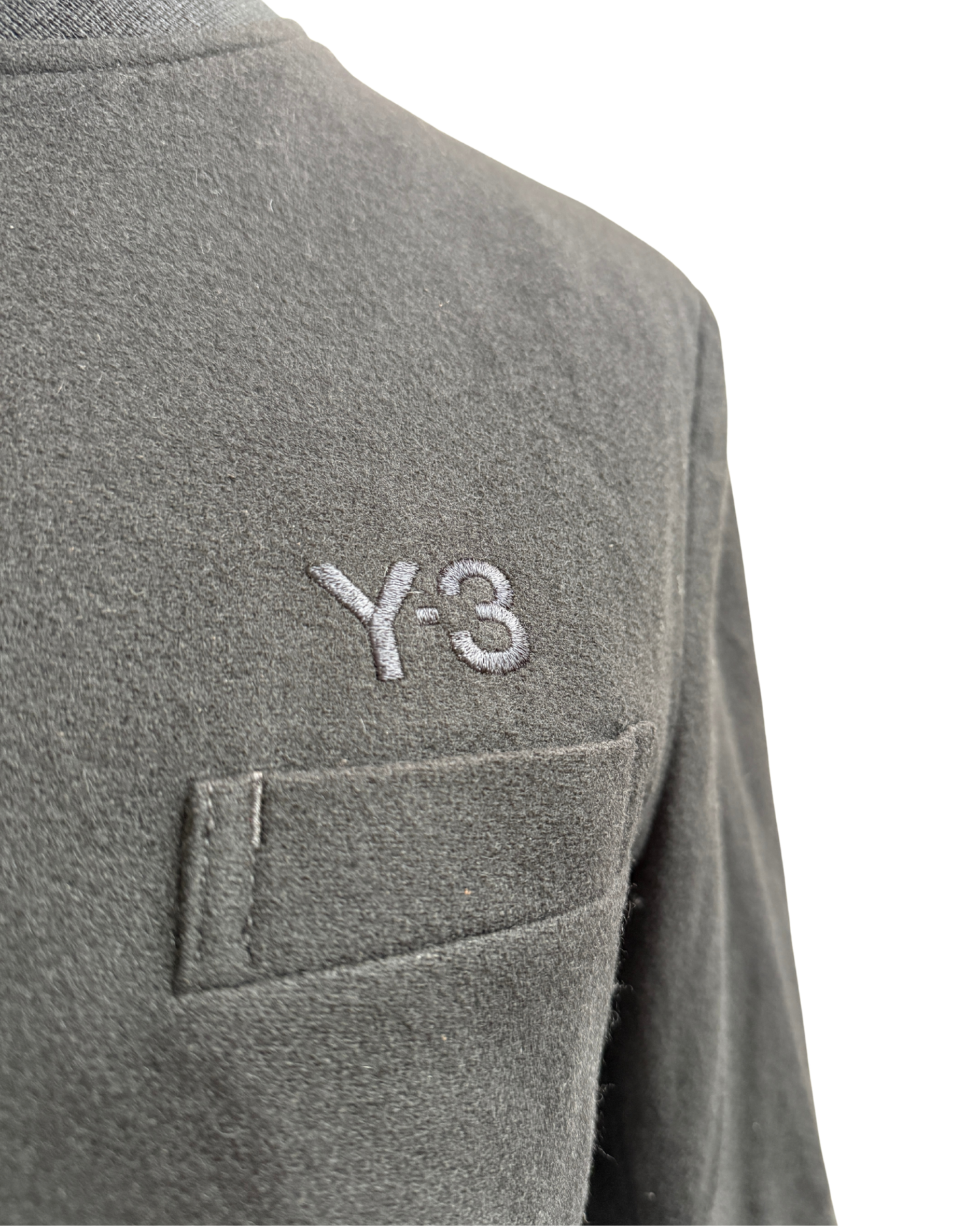 Black wool blend fabric texture detail and Y-3 embroidery