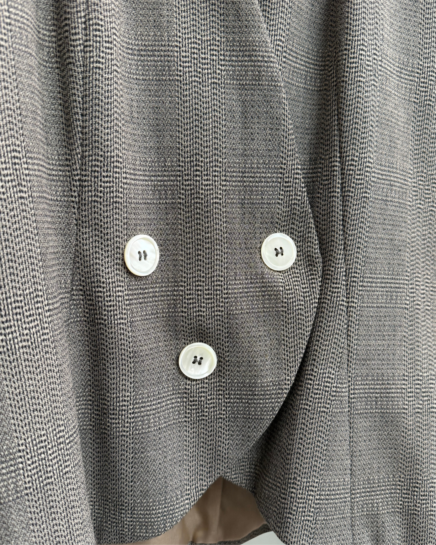 Close up of virgin wool fabric and button detail on Karl Lagerfeld blazer