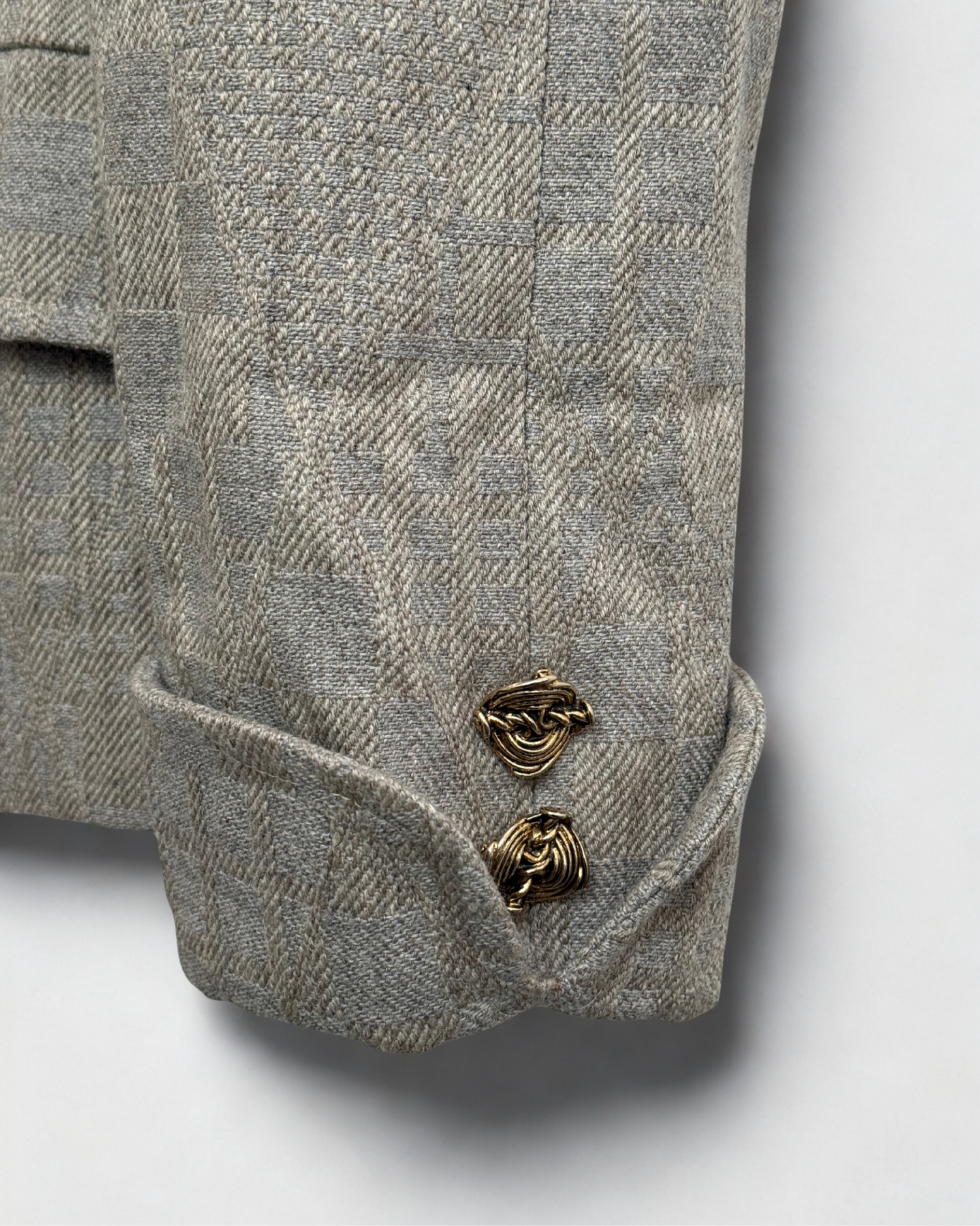 Gold button on sleeve detail on vintage beige wool blazer