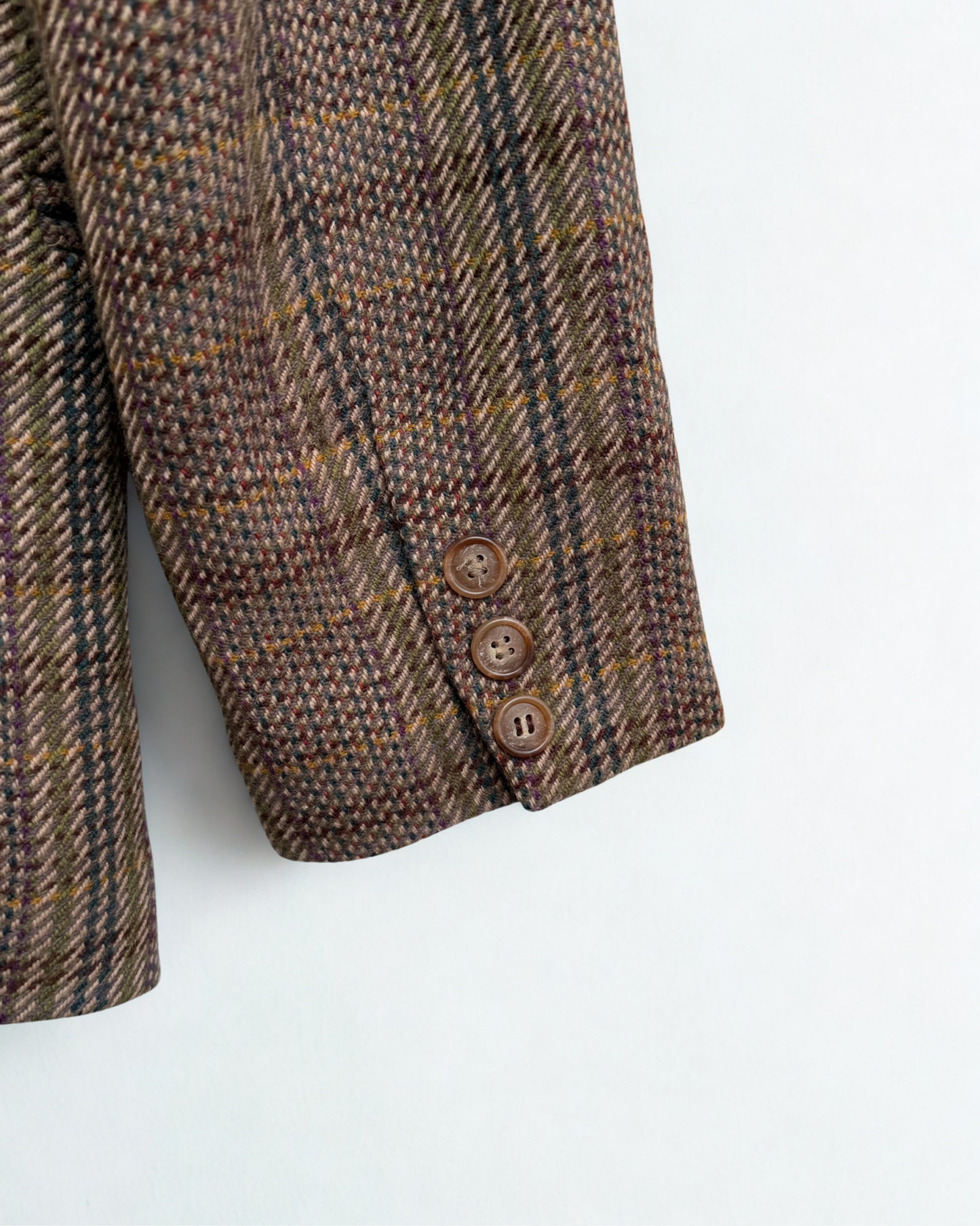 Close up of wool texture and button details on vintage Pellini blazer 