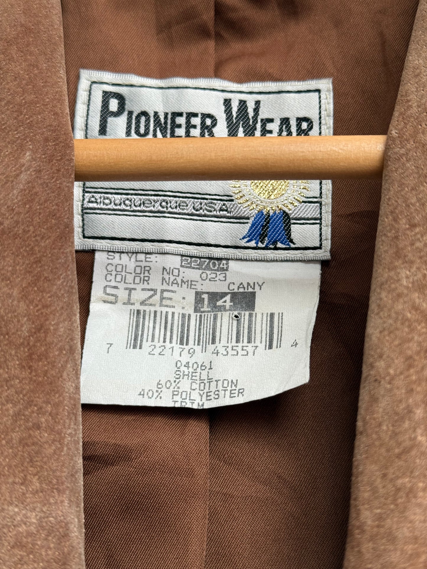 Close-up of a Pioneer Wear label on a brown jacket
