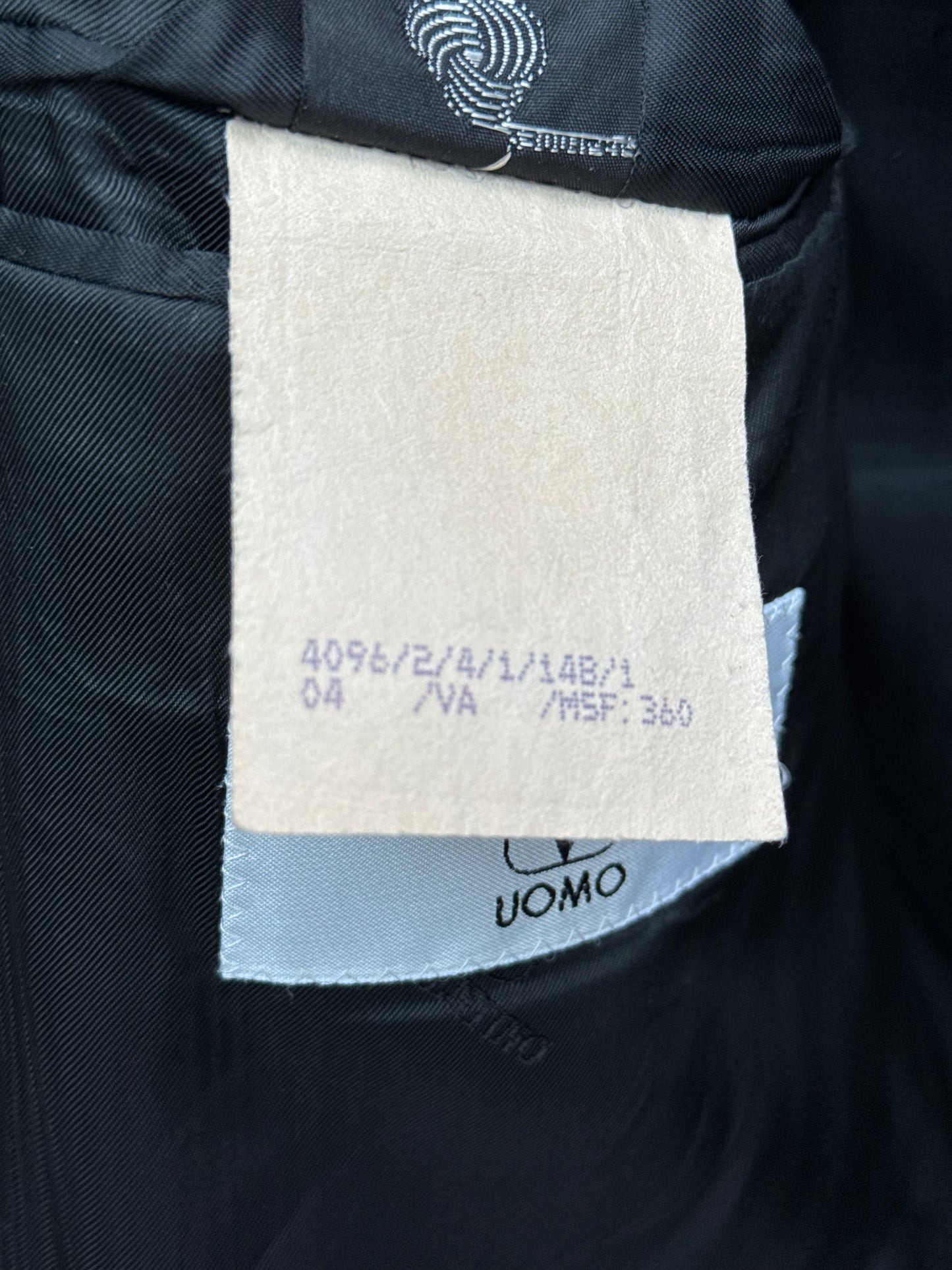 Close-up of a product label and woolmark on valentino blazer