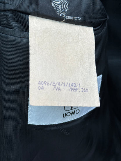 Close-up of a product label and woolmark on valentino blazer