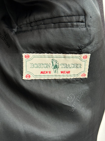 Close-up of a Boston Trader label on a piece of men's wear fabric.