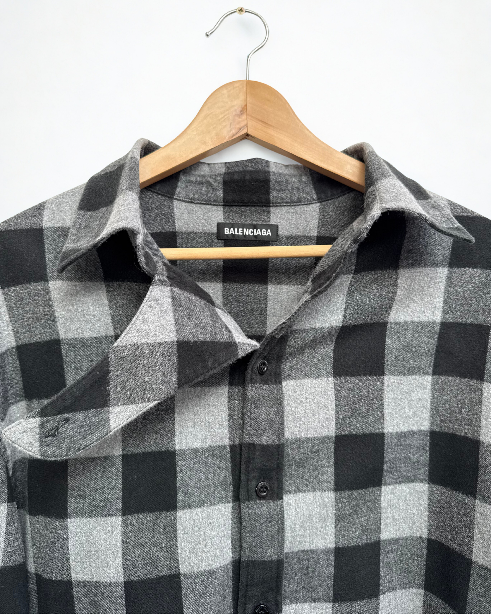 Collar and neck closure detail on Balenciaga flannel shirt