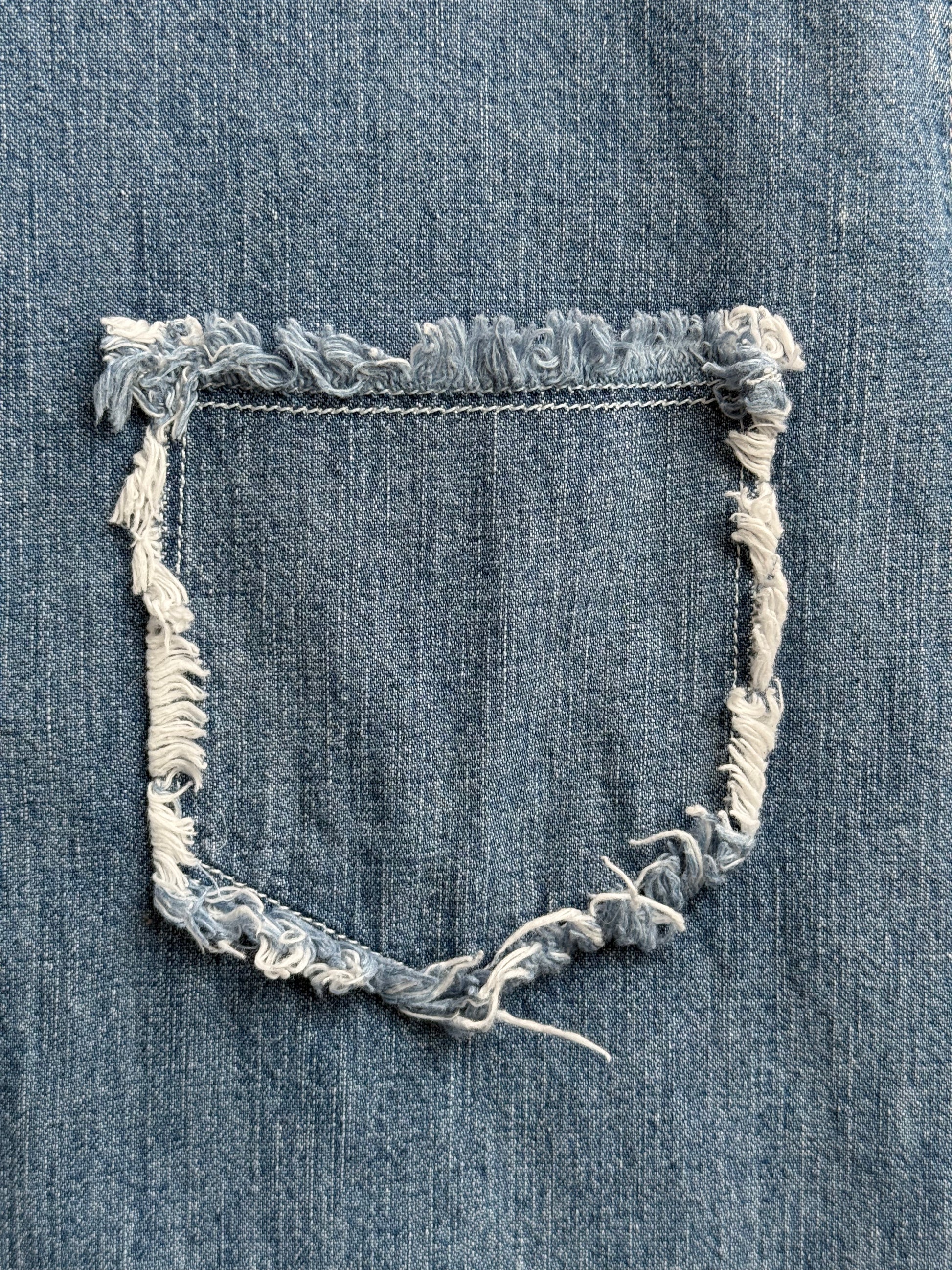 Front pocket fringe and stitching detail