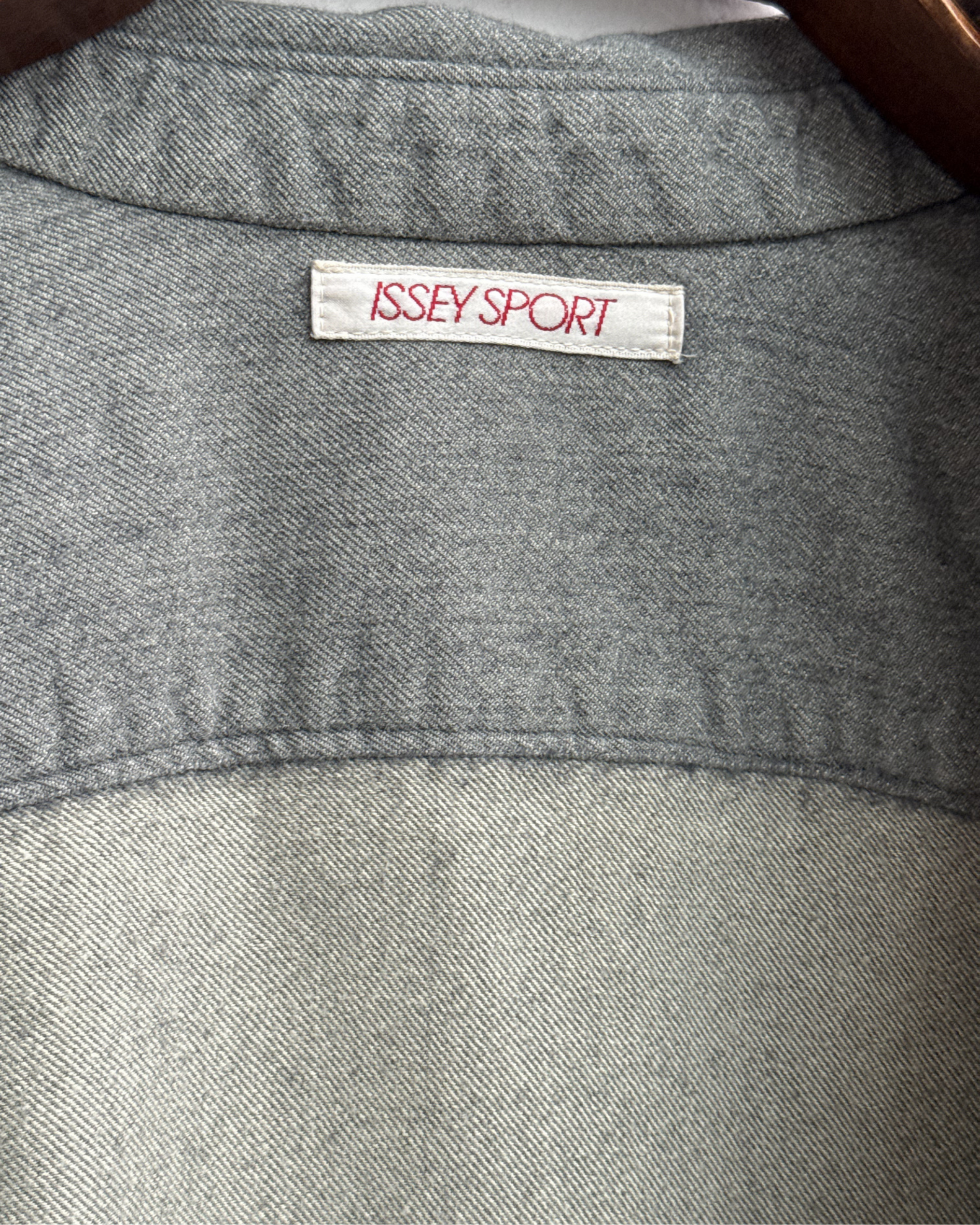 Gray shirt with 'Issey Sport' label 