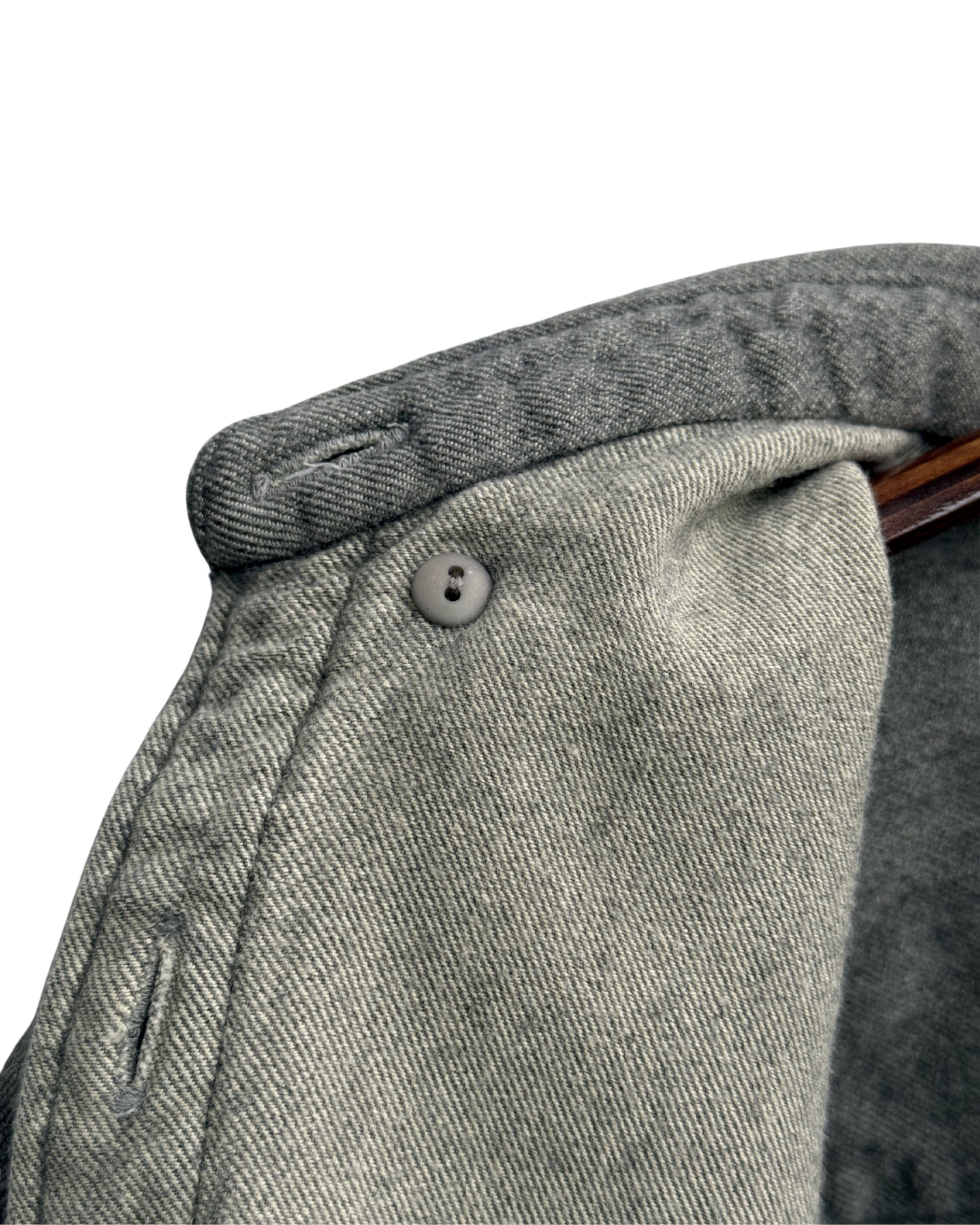 Close-up of inside button down collar on a grey shirt 