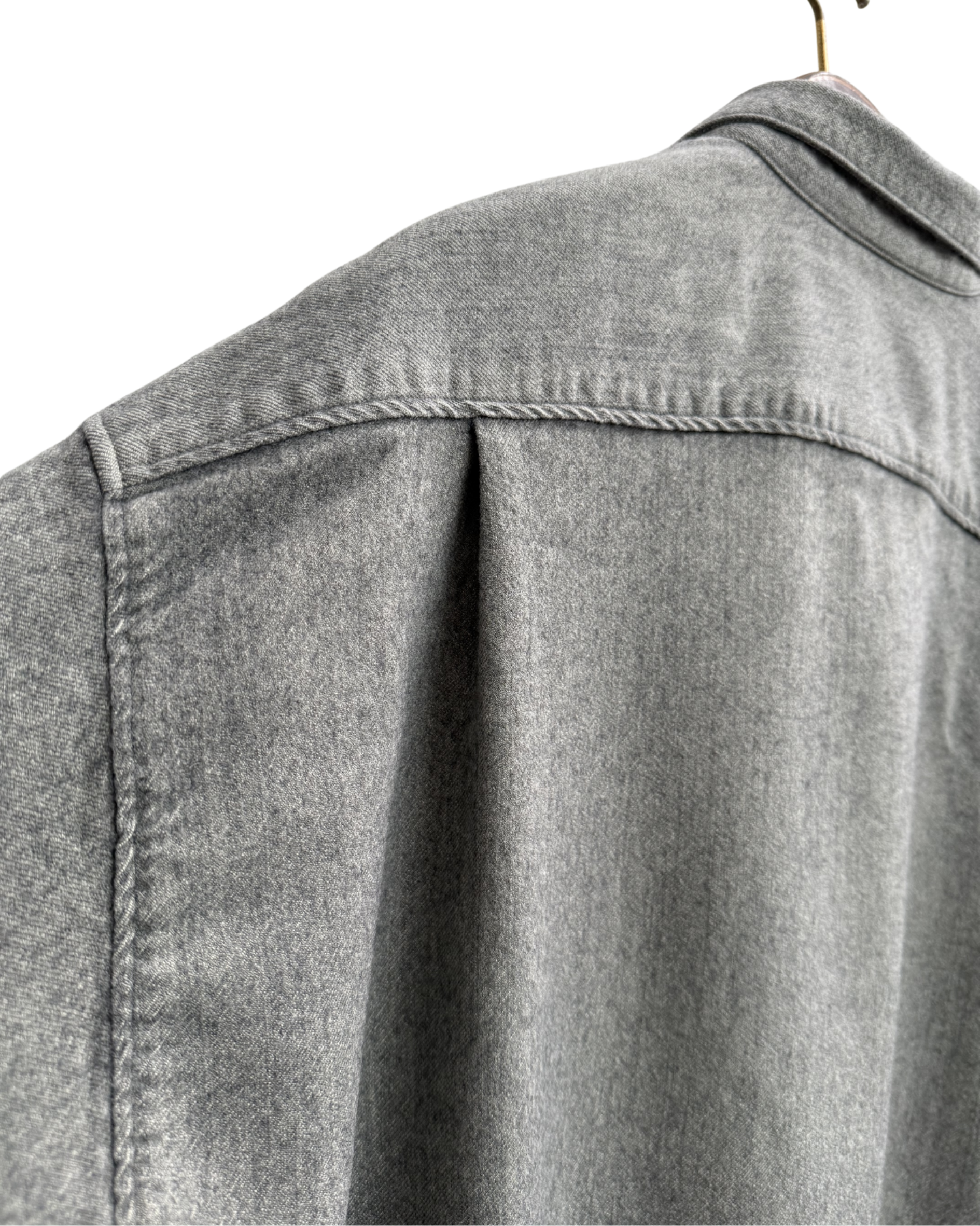 Pleat on back of Issey sports grey shirt