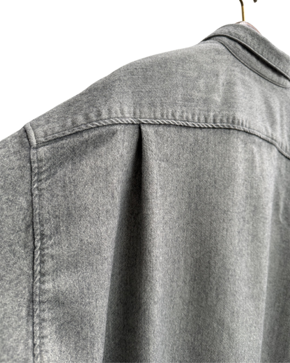 Pleat on back of Issey sports grey shirt